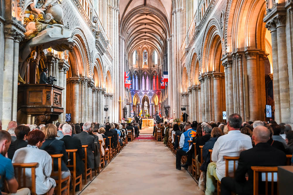 A congregation comes together for a thanksgiving service within the stunning medieval surround of Bayeux Cathedral