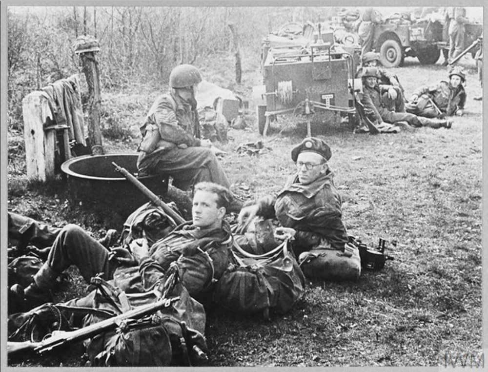 British airborne soldiers rest next to their jeeps while waiting to move off during Operation Varsity