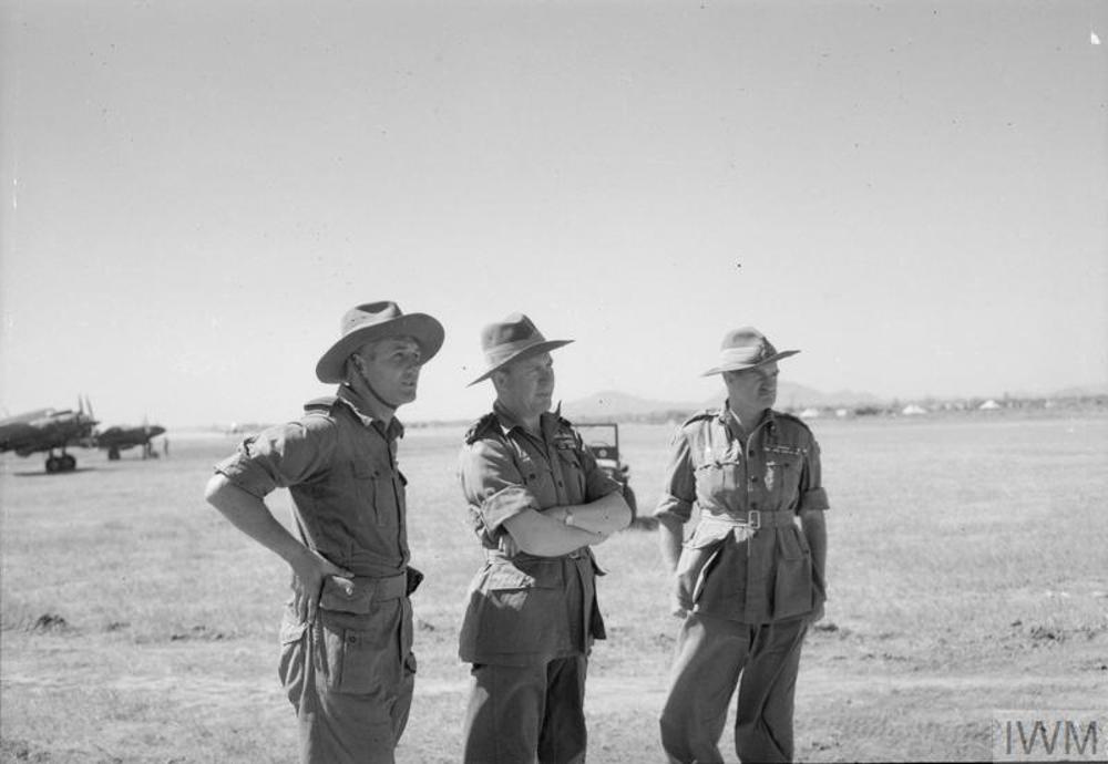 Air Vice Marshal S.F Vincent, Air Officer Commander-in-Chief of No. 221 Group RAF (centre), watches Hawker Hurricanes take off from Sadaung, Burma, on a strafing operation during the advance on Mandalay, with Lieutenant-General Sir William Slim, Commander of the 14th Army (right), and Group Captain D O Finlay, Commanding Officer of No. 906 Wing RAF (left).