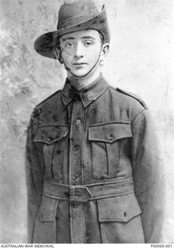 Private Him Martin in his First WOrld War uniform. Brass unit badges are attached to his collar. He is wearing a typical Australian military hat.