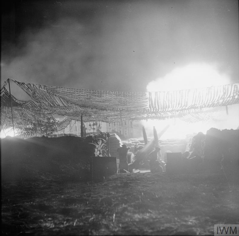 An artillery piece firing over the Straits of Messina during WW2.