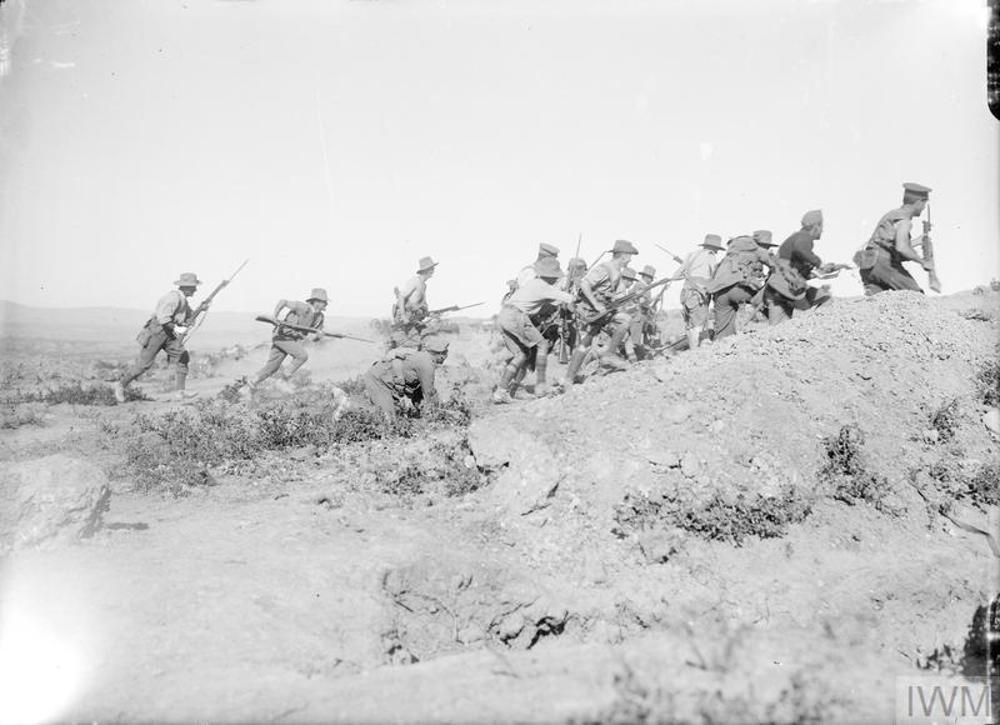 Australian WW1 soldiers charging up a rocky outcrop during the fighting at Sarai Bair in Gallipoli.