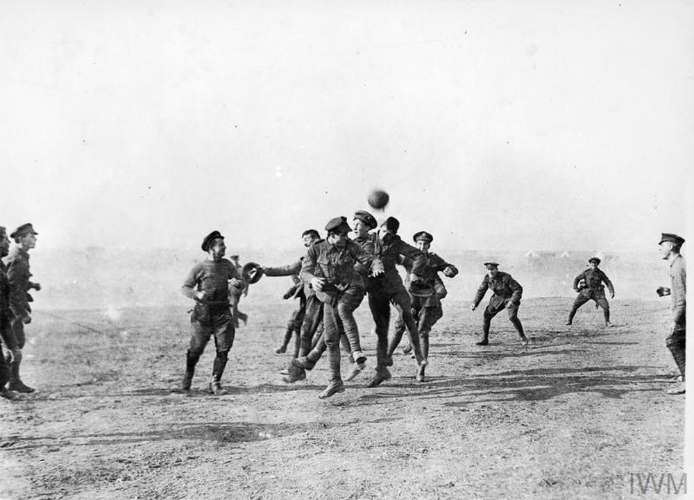 WW1 British soldiers playing a game of football in Salonika, Christmas Day, 1915.