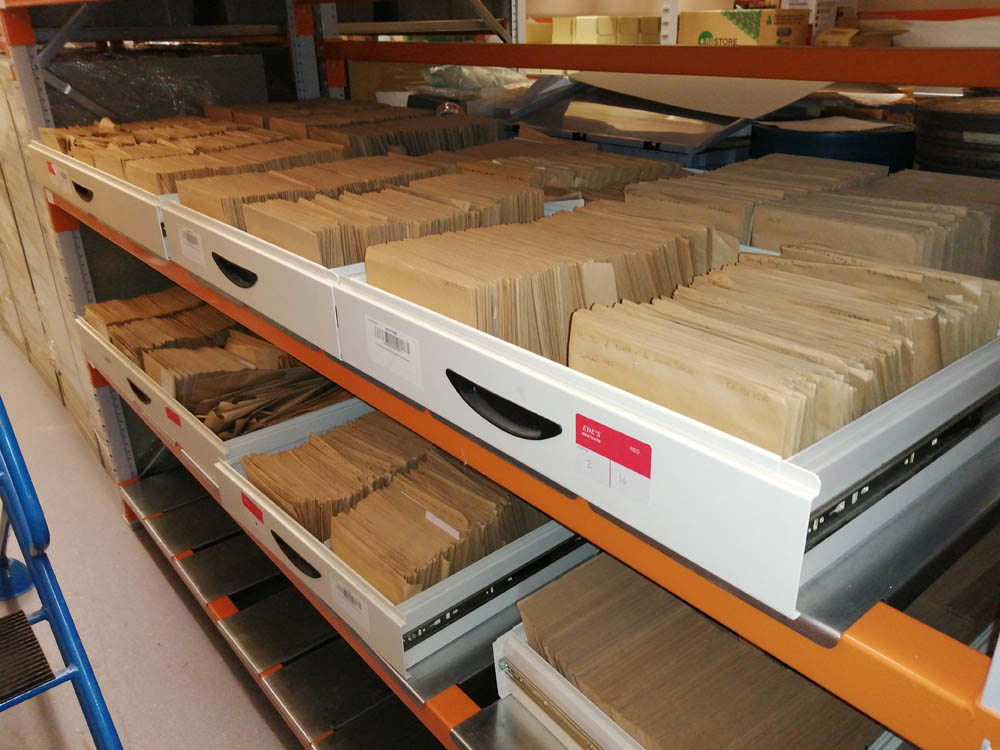 Brown envelopes containing film negatives stored on a variety of drawers.
