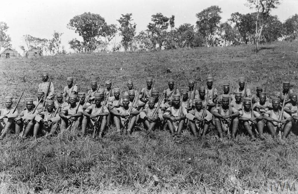 Squad of King's African Rifles soldiers resting on an embankment somewhere in Tanzania circa 1917.