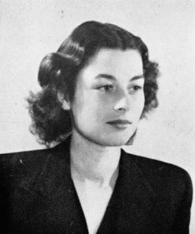 Headshot of Violette Szabo showing her dark wavy hair, pointy noice, and pale complexion.