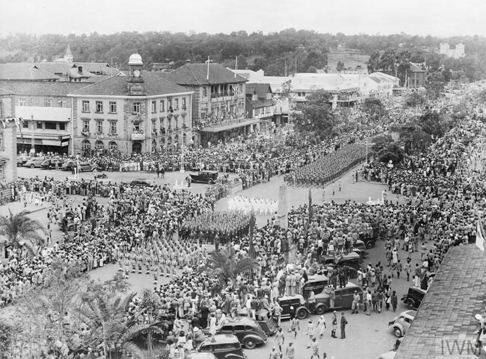 Military units parade through downtown Nairobi, Kenya, on VJ Day 1945.